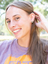 Rough labradorite pronged stud earrings by Fair Anita displayed flat — sustainable recycled brass setting, nickel-free