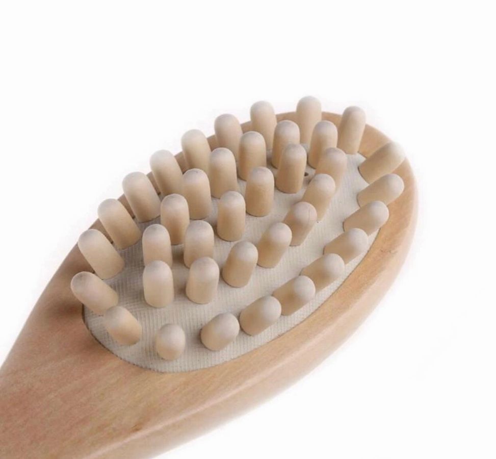 Wooden brush with soft bristles on a white background