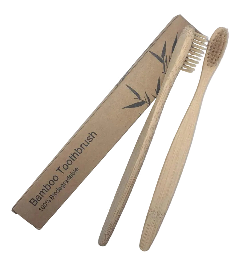 Two bamboo toothbrushes with a cardboard packaging on a white background