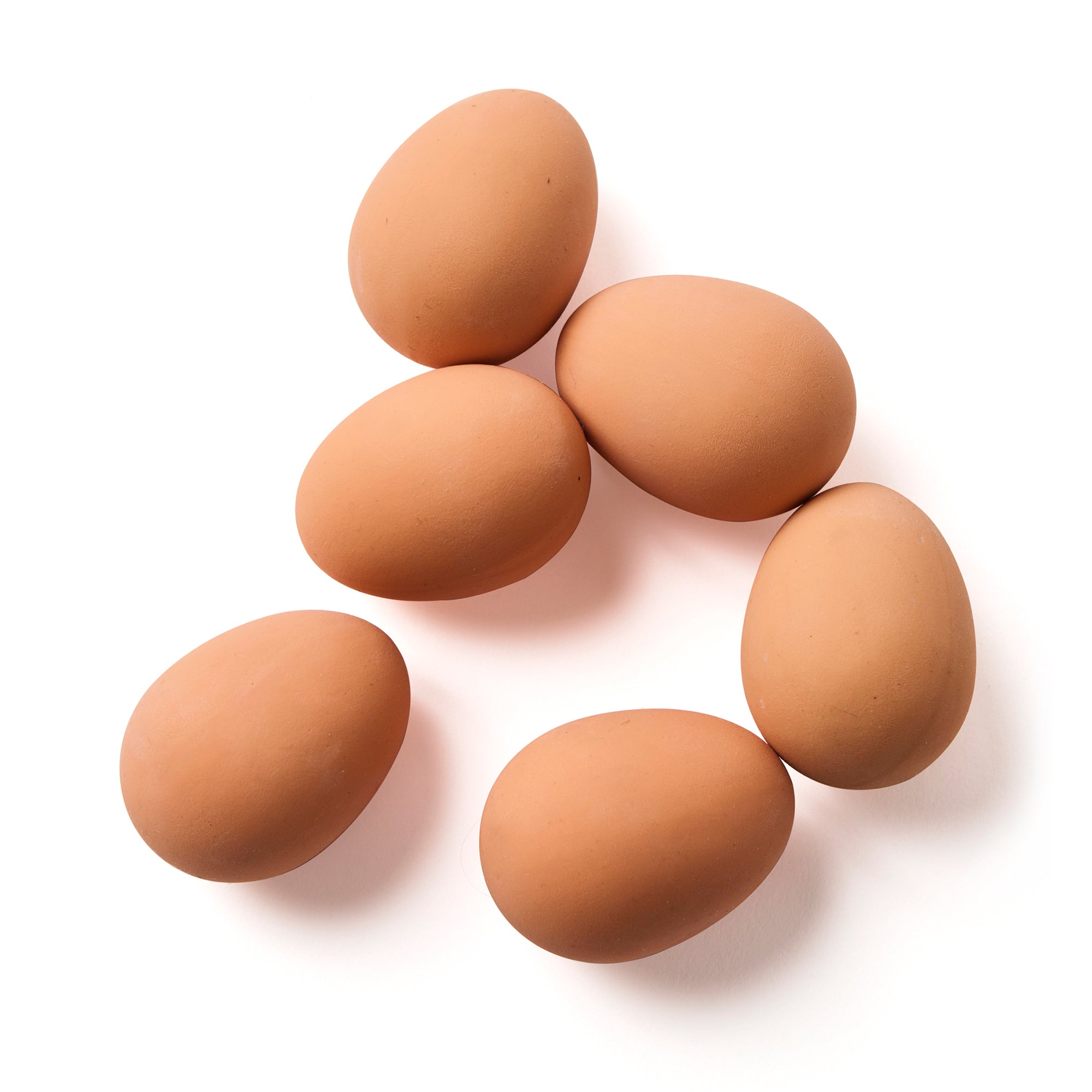 Set of six loose realistic rubber bouncy eggs by Elseware Unplug on a white background