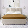 Beige upholstered bed with brown mattress cover in a modern bedroom setting.