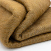 Folded brown fabric on a white background