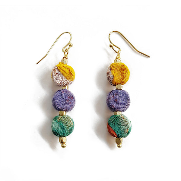 Colorful beaded earrings on a white background