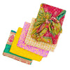 Furoshiki reusable sari silk wrapping cloth folded to show its colors and pattern