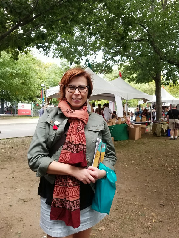 Person wearing the Ganapati Meditation Shawl as a wrap, showcasing the terracotta colour and traditional Ganesha print by OMSutra