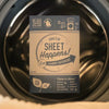 Close-up of Sheet Happens laundry detergent sheet – vegan, paraben-free, and cruelty-free formula