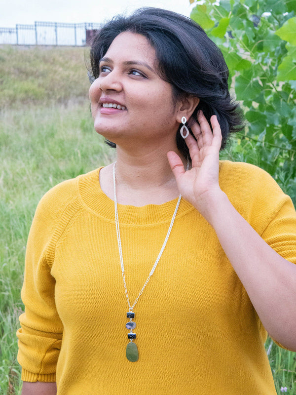 Fair trade silver and black long pendant necklace by Fair Anita styled on model