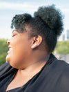 Close-up of Fair Anita silver leaf studs worn as an ear runner on a model