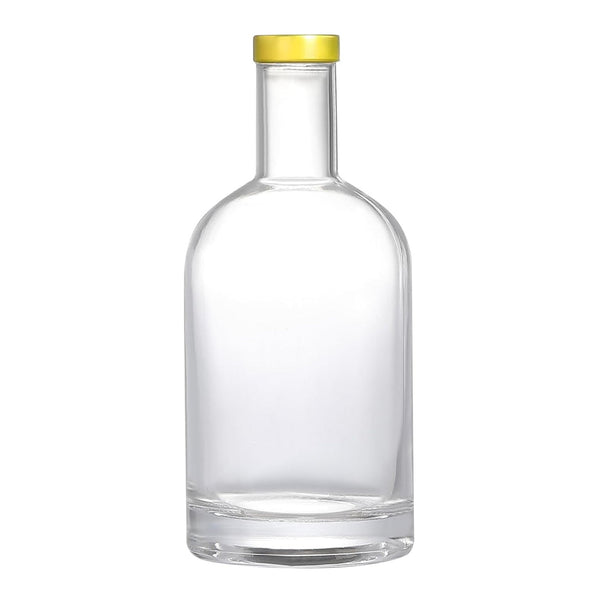 Clear glass bottle with a gold cap on a white background