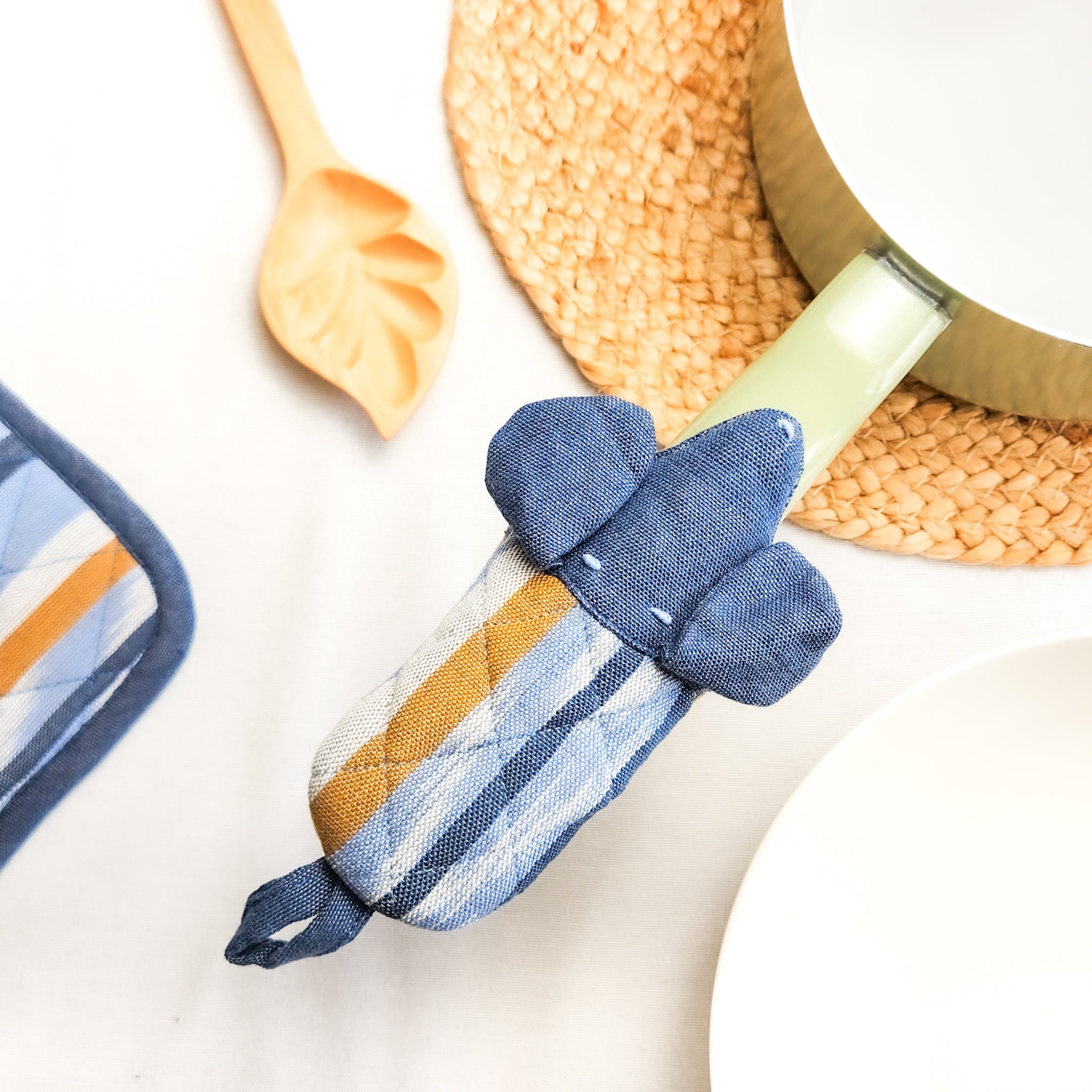 Protect your hands in style with our adorable Dog Pot Holder. This handmade, eco-friendly pot holder features a charming dog design and is perfect for adding a playful touch to your kitchen.