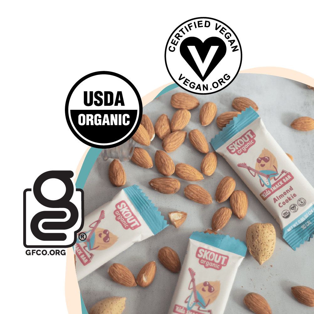 Skout organic cookie bars with almonds on a white background, featuring USDA Organic, Certified Vegan, and GFCCO logos.