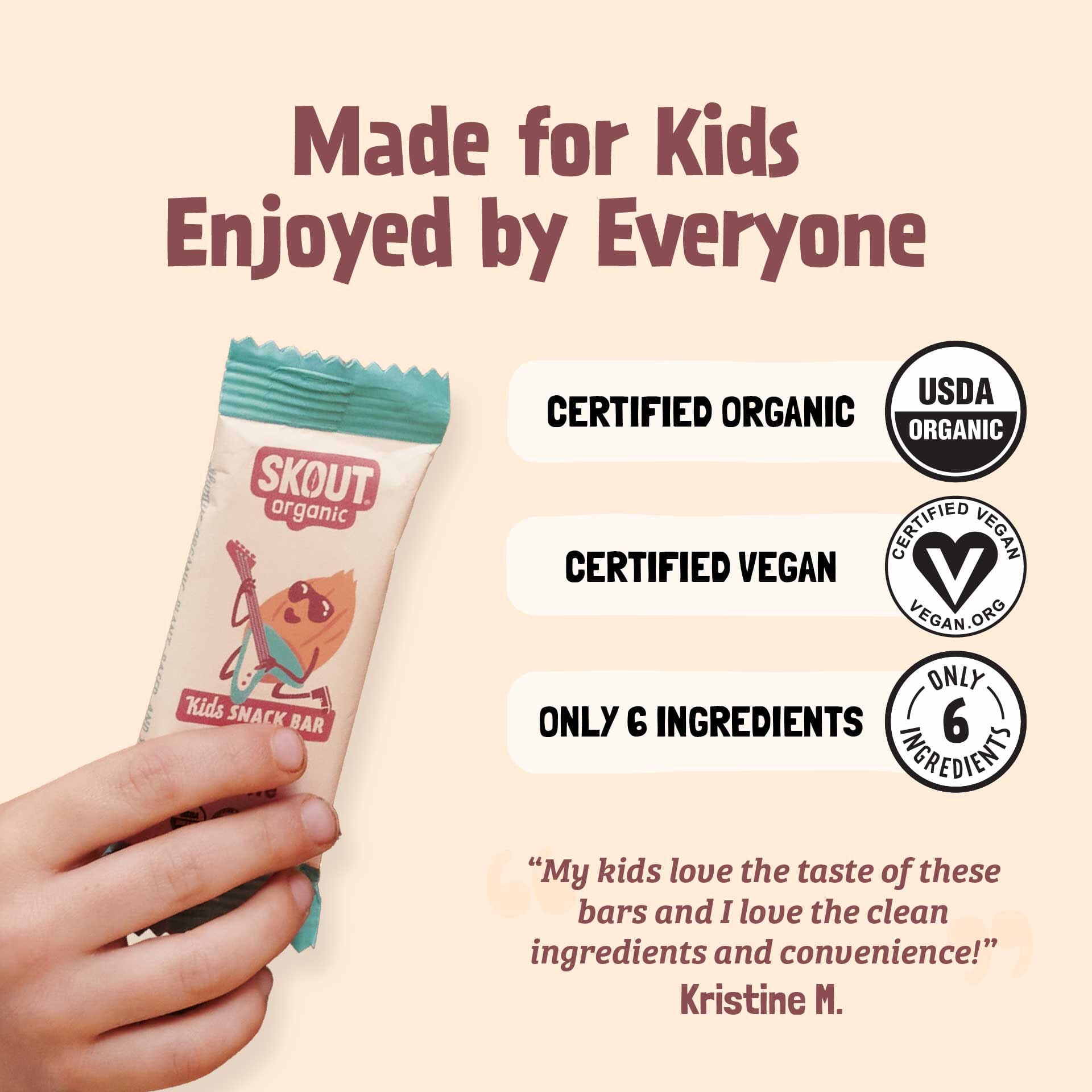 Skout Organic Kids Shark Bar with certification logos and a hand holding the bar on a beige background.