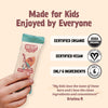 Skout Organic Kids Shark Bar with certification logos and a hand holding the bar on a beige background.