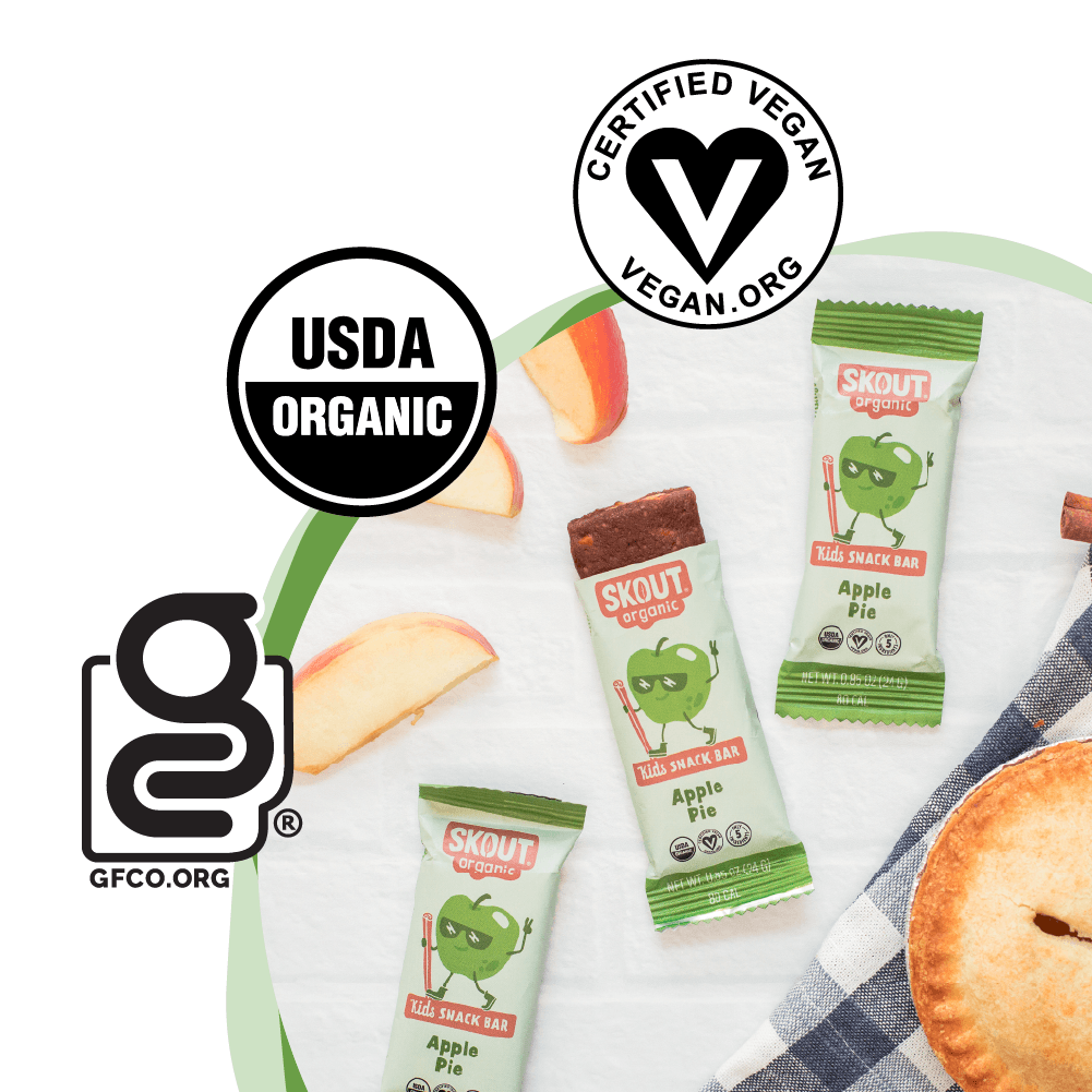 Skout Organic snack bars with apple slices and a pie, featuring USDA Organic, Vegan, and GFCO logos.