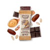Skout Organic Kids Snack Bar with chocolate and peanut butter, surrounded by ingredients on a dark background