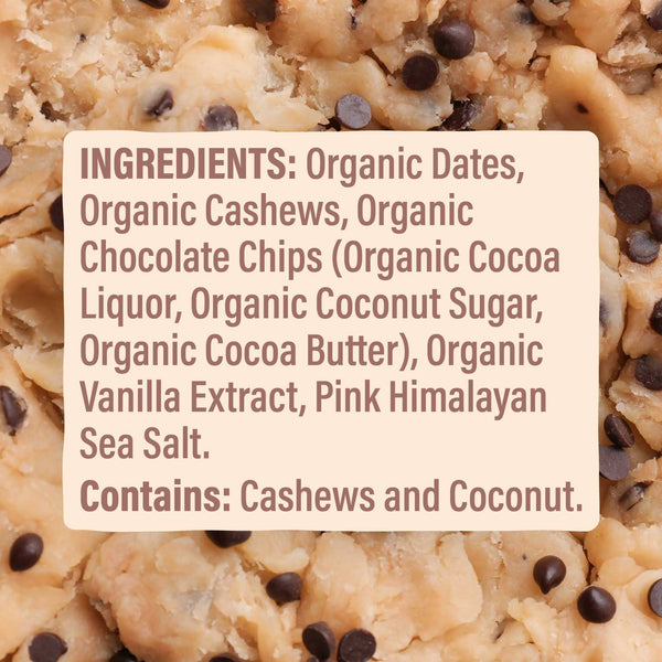 Close-up of a cookie bar with ingredients listed on a white label, surrounded by cookie bars.