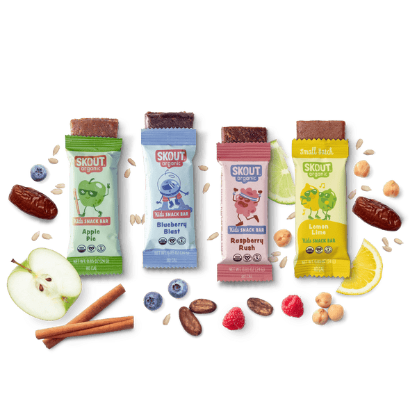 Five Skout snack bars with various flavors on a dark background