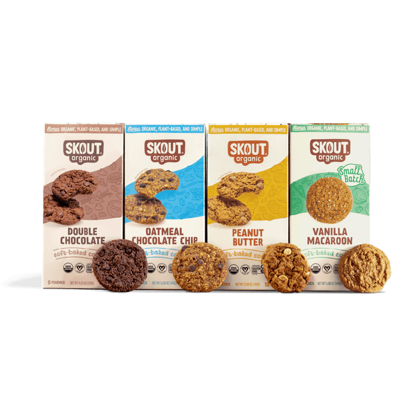 Four boxes of Skout organic cookies on a blue background
