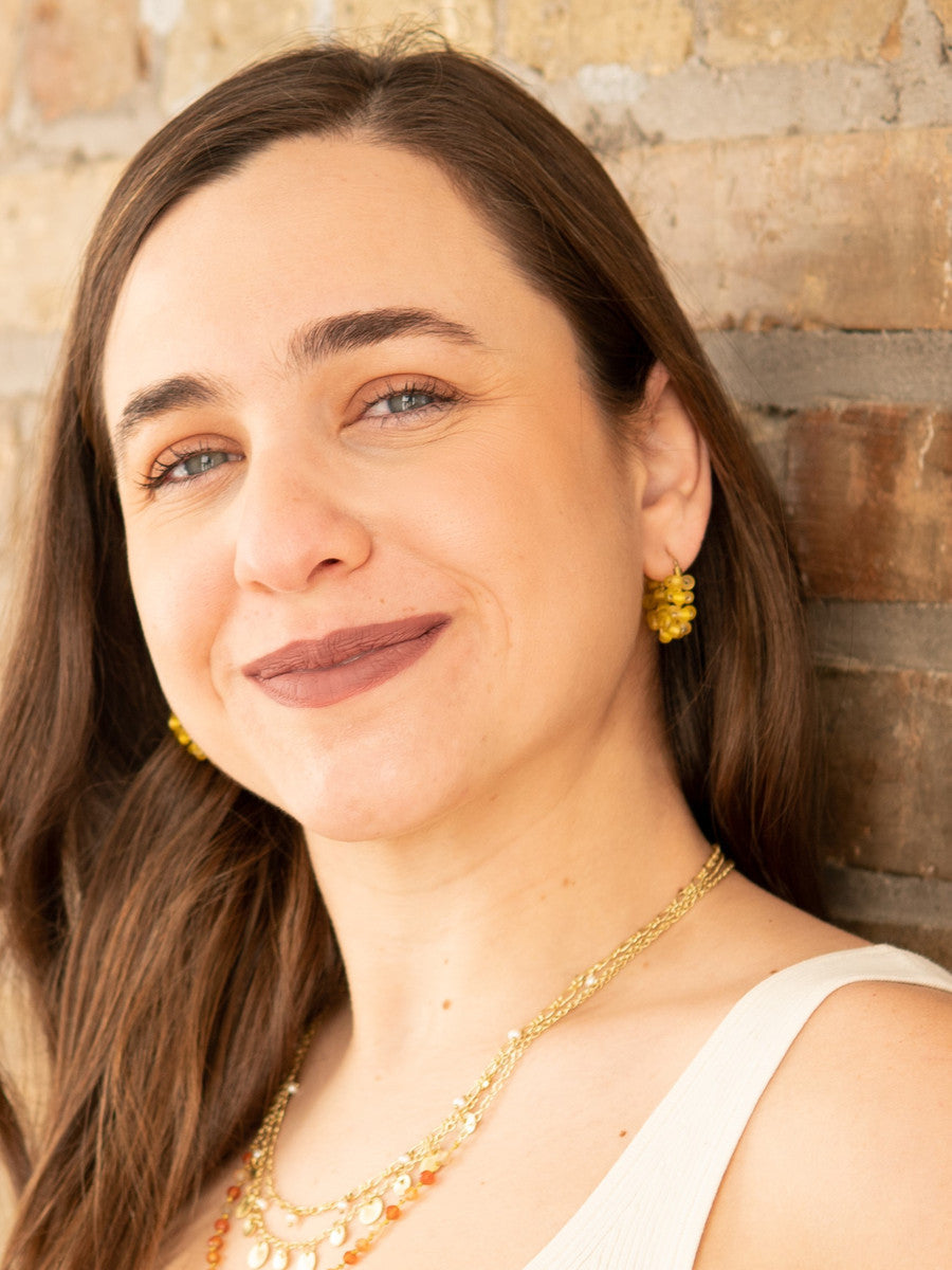Small yellow beaded hoop earrings by Fair Anita shown from the front, nickel-free and ethically handcrafted in India