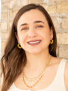 Close-up of small yellow beaded hoop earrings by Fair Anita, 1 inch diameter with recycled glass beads
