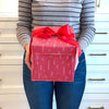 Flat-lay of EverWrap small red collapsible gift box showing compact storable design