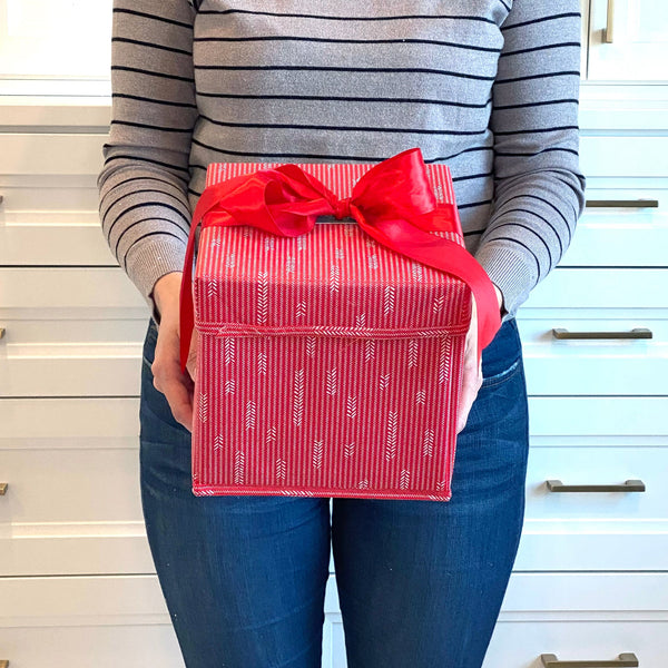 Flat-lay of EverWrap small red collapsible gift box showing compact storable design