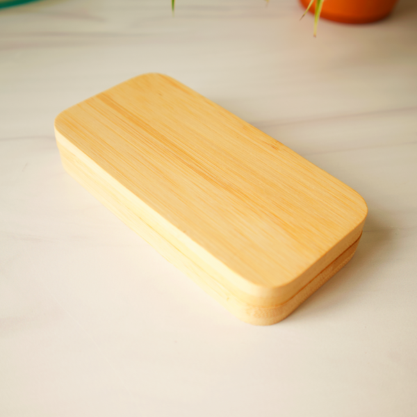 Wooden rectangular light on a beige surface