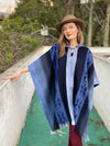 Full-length view of Soft Blues Alpaca Poncho showing relaxed poncho silhouette