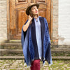 Soft blues and grey alpaca poncho draped over model, handcrafted in Ecuador by Purely Alpaca