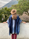 Model wearing Soft Blues Alpaca Poncho styled as an everyday outfit