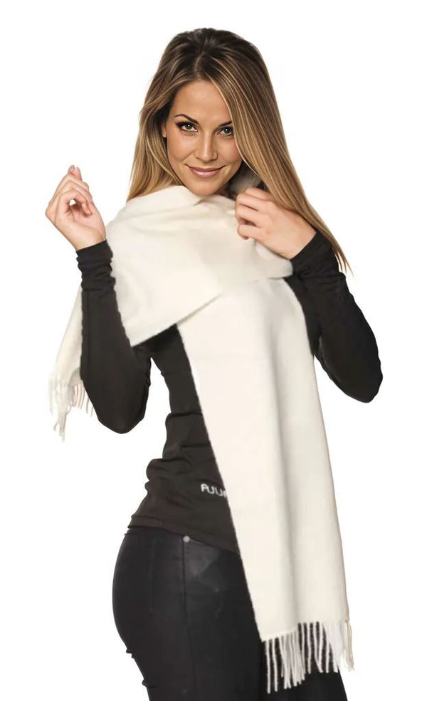 Woman wearing a white scarf with a black background