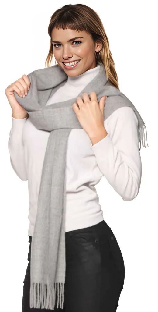 Woman wearing a gray scarf with a white background
