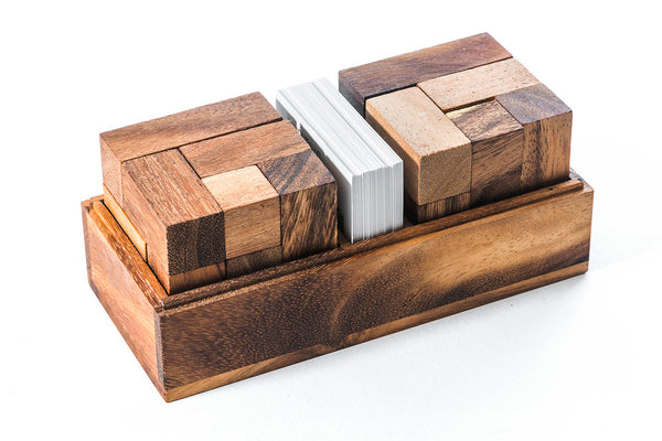 Wooden block puzzle with a white book inside on a white background