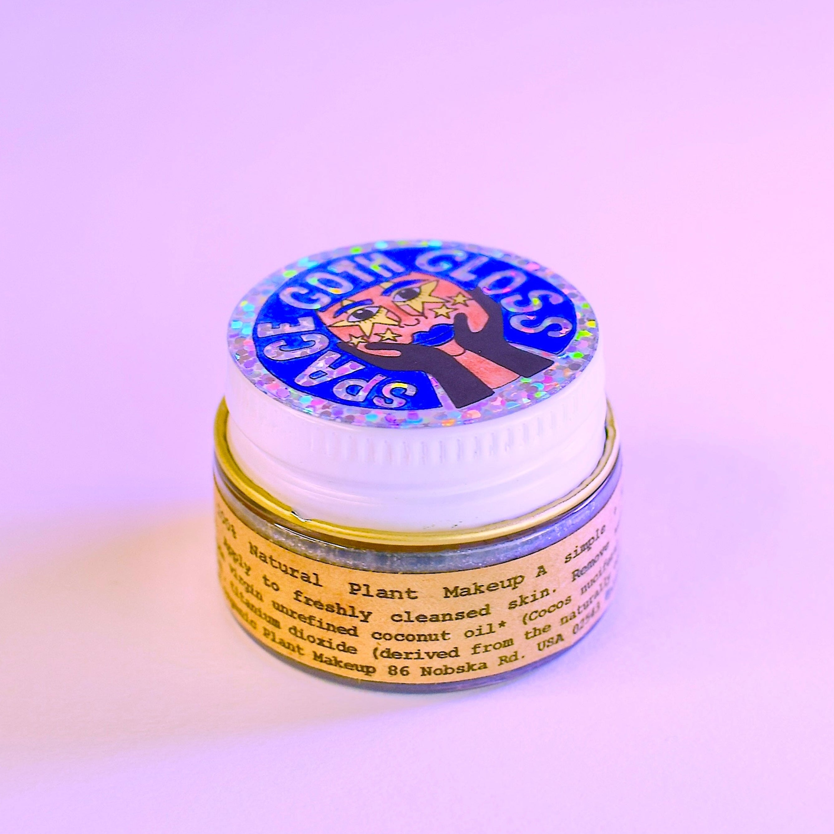 Makeup removal pad with colorful packaging on a light purple background