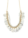 Close-up of speckled upcycled bone and brass-plated recycled metal chain necklace detail