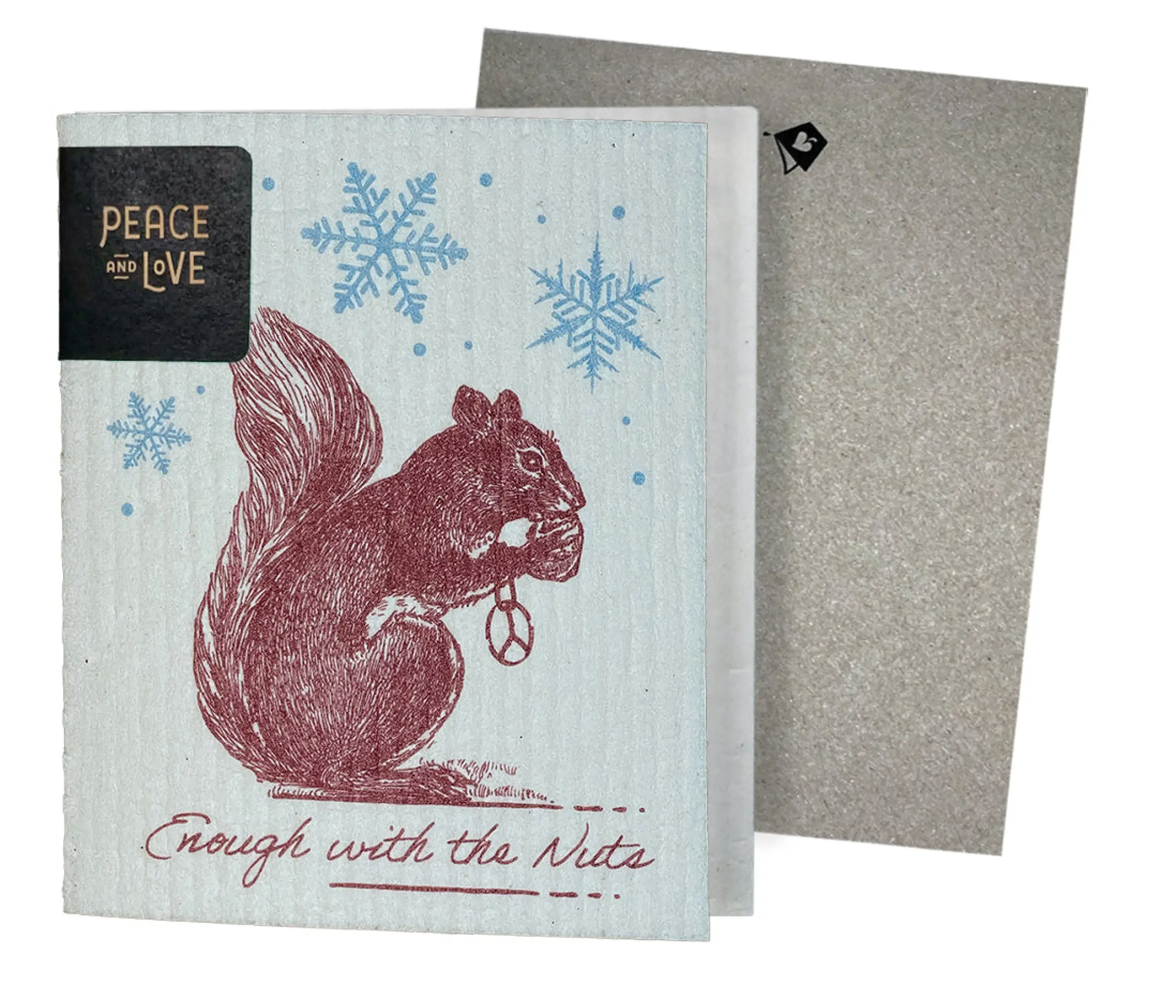 A greeting card with a vintage etching of a squirrel holding a snowflake, with ' Enough with the Nuts ' text, against a blue background. A non-velop envelope is shown to the side.
