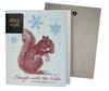 A greeting card with a vintage etching of a squirrel holding a snowflake, with ' Enough with the Nuts ' text, against a blue background. A non-velop envelope is shown to the side.