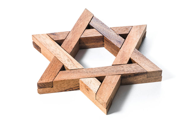 Wooden Star of David on a white background