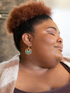 Teal Opulence Earrings by Fair Anita styled to show full starburst silhouette against neutral background