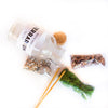 Close-up of DIY terrarium kit contents including decorative elements and step-by-step setup guide