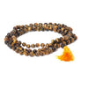 Close-up of natural tiger eye mala beads showing warm golden-brown crystal finish, handmade by artisans in India