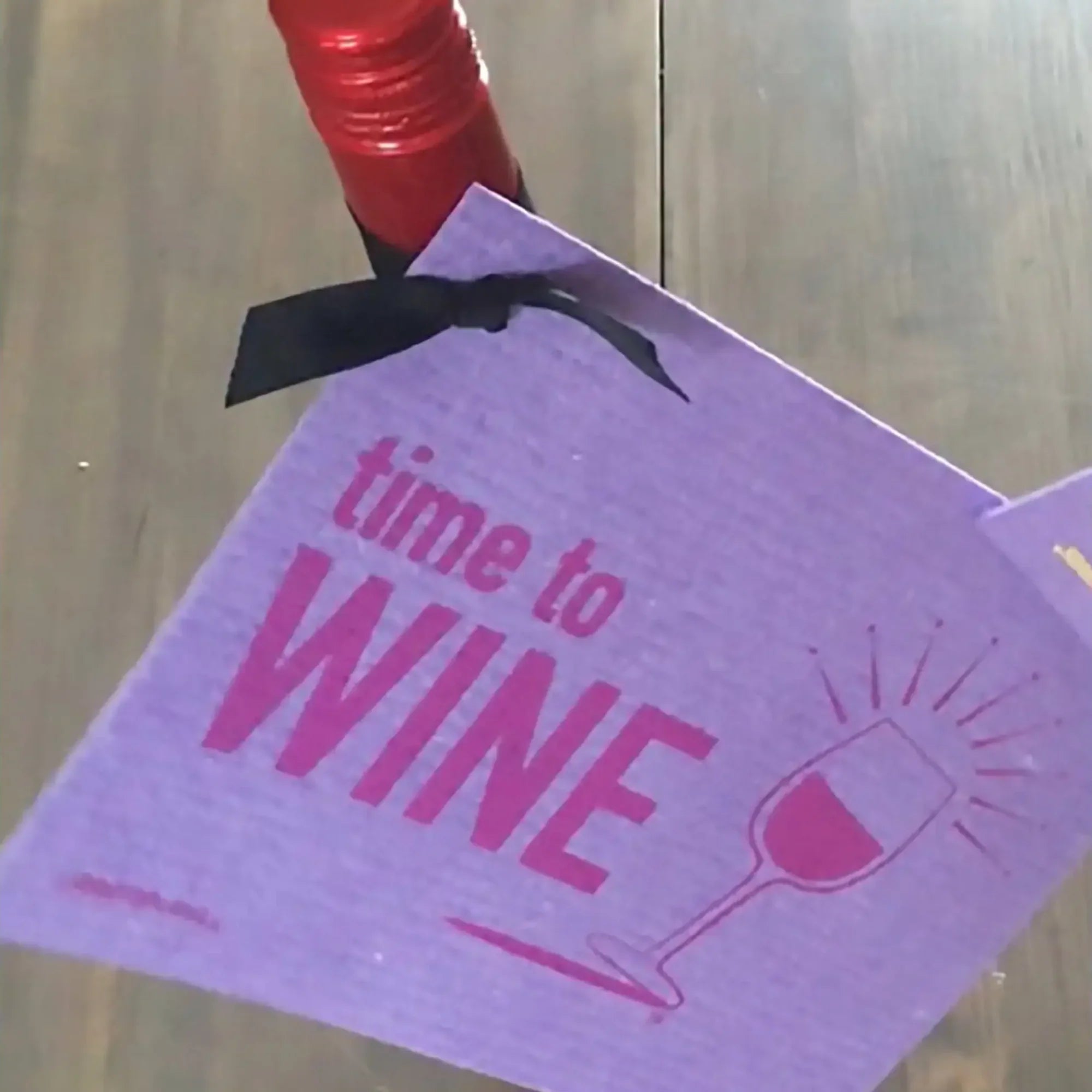 Time to Wine Red Swedish Dishcloth laid flat — bold red design, 8 x 6¾ inch reusable cleaning cloth for kitchen use