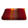Striped fabric with red, orange, and yellow colors on a white background