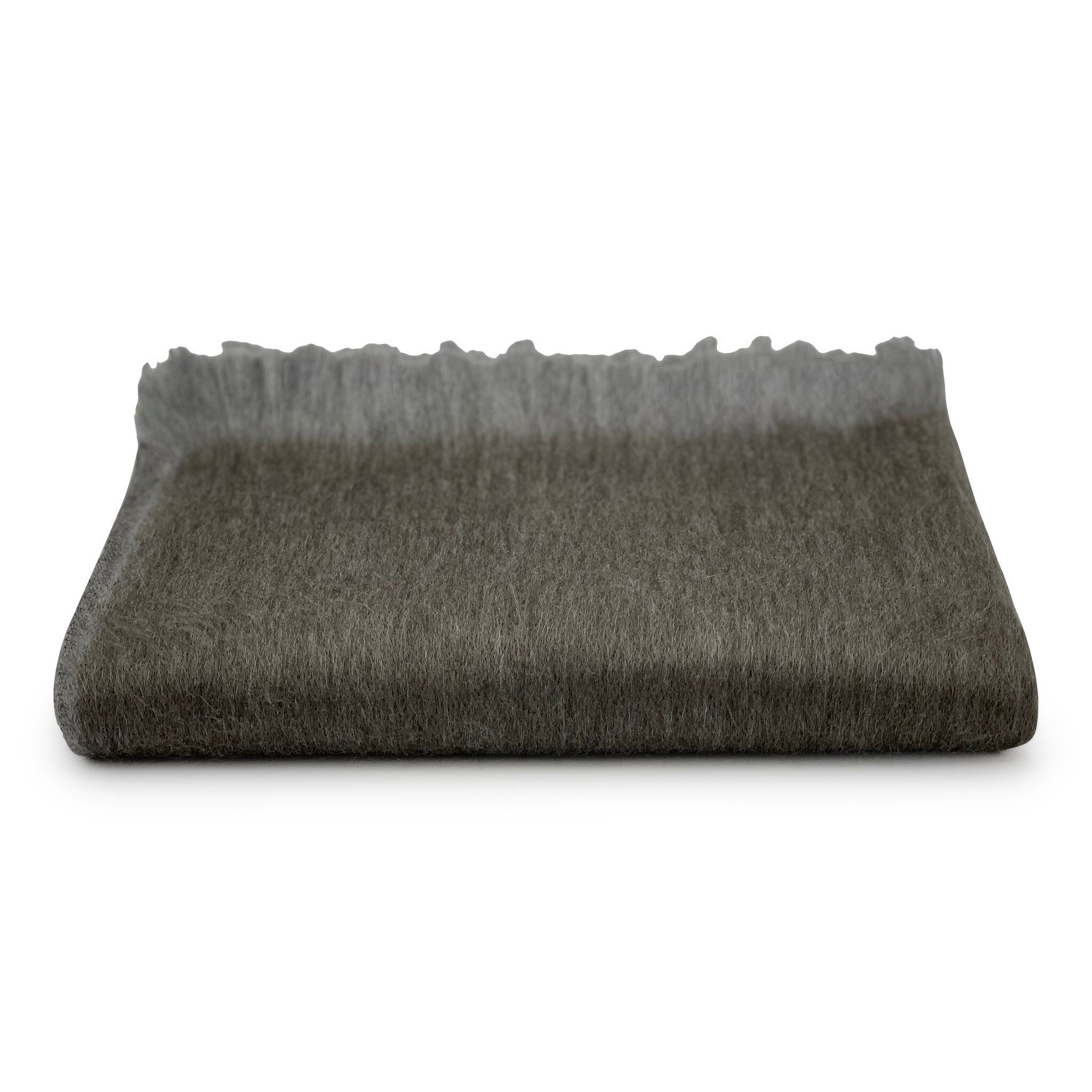 Folded dark gray blanket on a white background