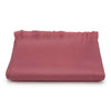 Folded pink fabric on a white background