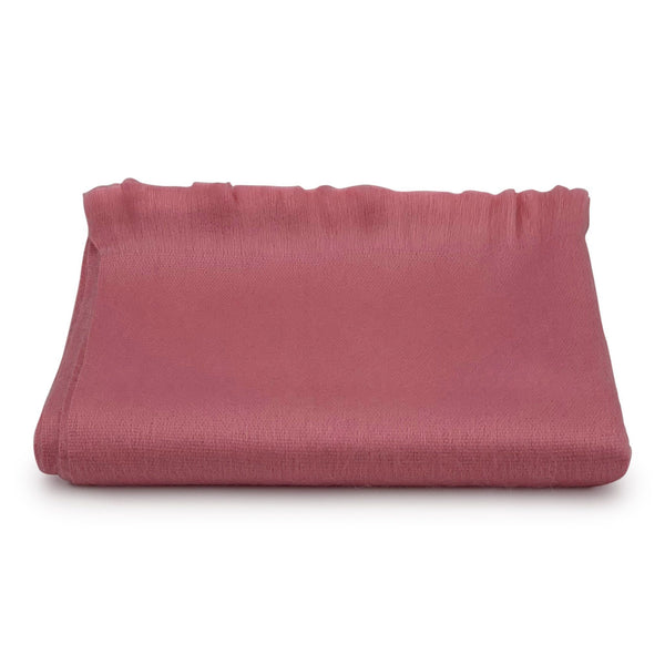 Folded pink fabric on a white background