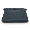 Dark gray fabric with frayed edges on a white background