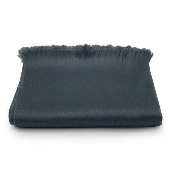 Dark gray fabric with frayed edges on a white background