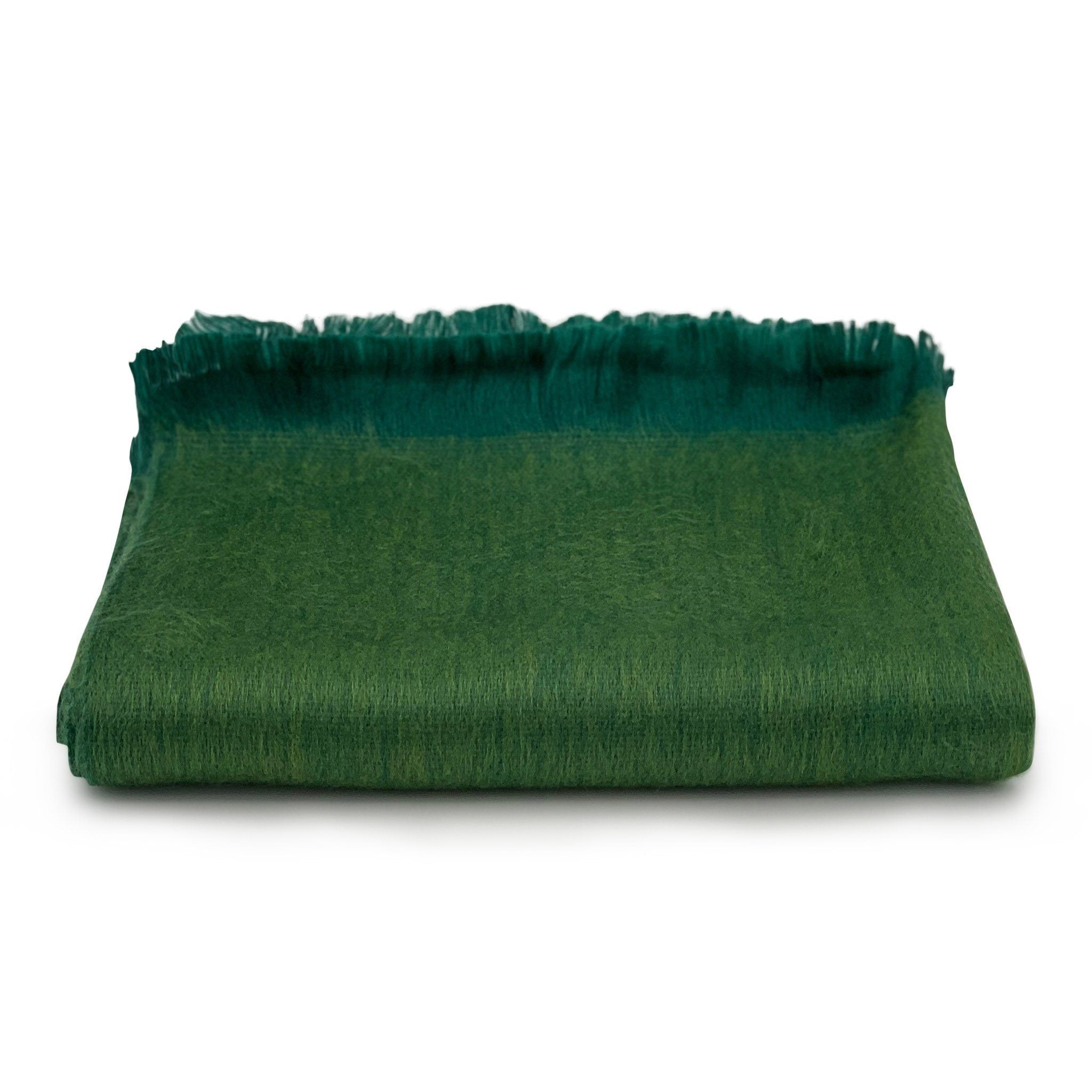 Green fabric with frayed edges on a white background