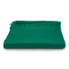 Green blanket with frayed edges on a white background